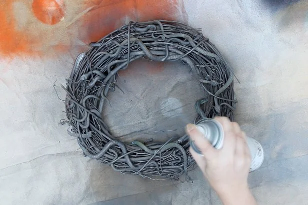 Optionally, spray paint the entire wreath a solid color to make the snakes more subtle.