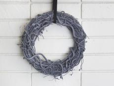 Gray Snake Wreath Hung by Black Ribbon