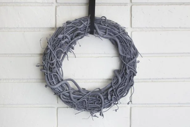 Gray Snake Wreath Hung by Black Ribbon