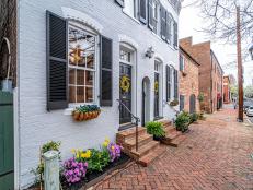 Gray Brick Exterior on Colonial, Semi-Detached Home With Brick Walkway