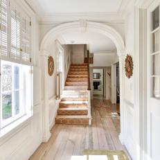 Bright, White Foyer With Historic Details