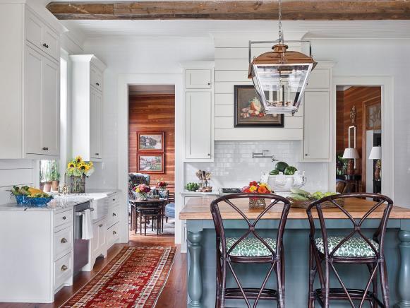 White cupboards and subway tile accent a traditional Southern kitchen.