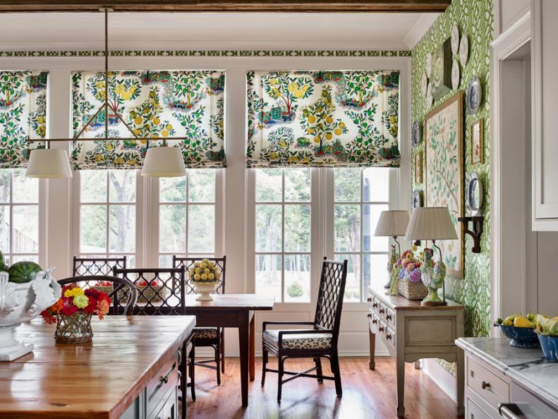 Breakfast room with bright green patterned fabric and wallpaper.