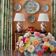 Porcelain Display and Colorful Flower Arrangement in Traditional Dining Room