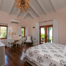 Pink Tropical Bedroom With Chandelier