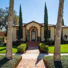 Stucco, Italianate Home With Landscaped Front Yard