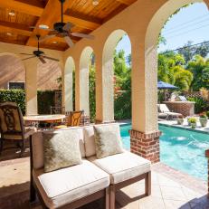 Stucco Covered Patio With Attached Swimming Pool