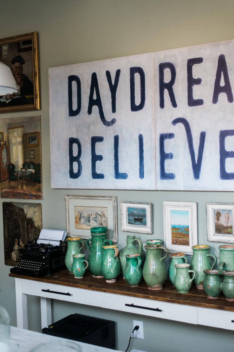 "Daydream Believer" art with green vintage pottery.