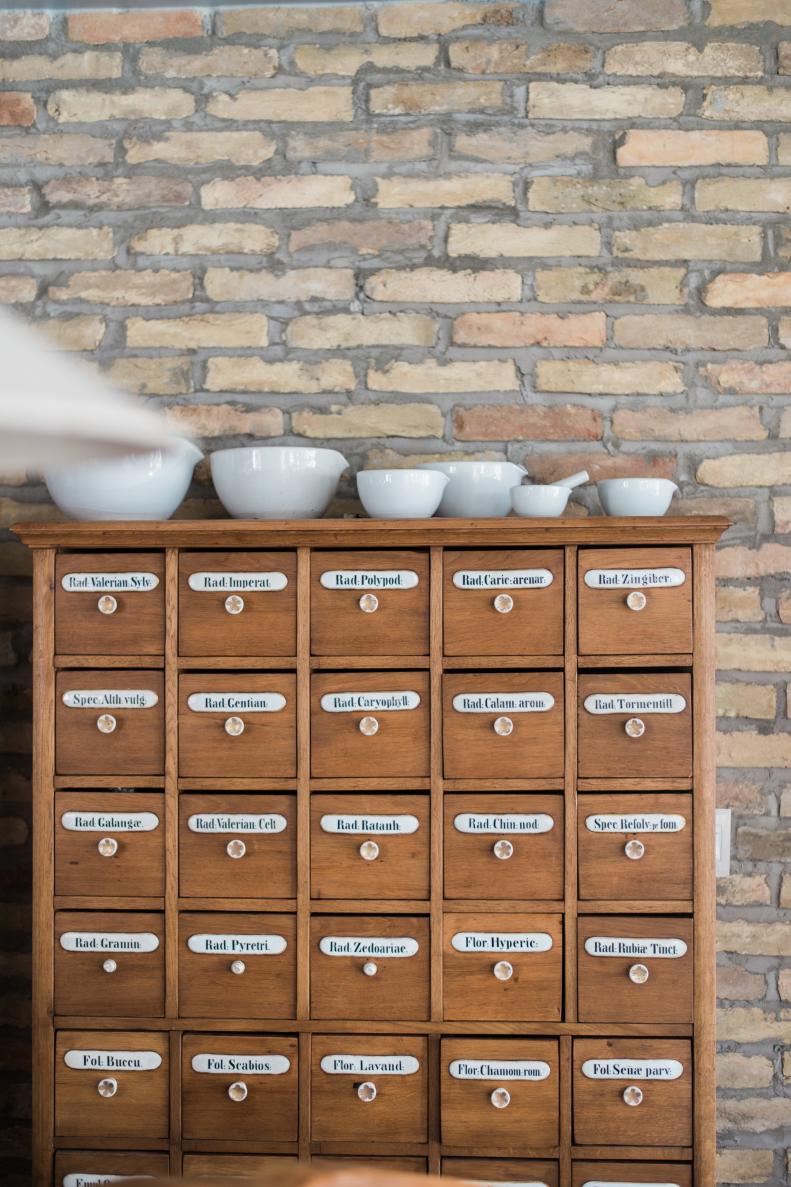 Vintage apothecary chests feature hand-painted labels.