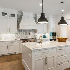 White Kitchen With Full Walls of Custom Wood Cabinets
