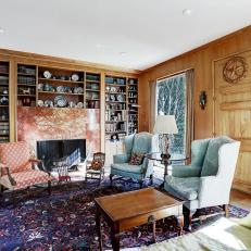 Pecan-Paneled Library With Picture Windows Leads to Expansive Rear Patio