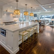White Open Plan Kitchen With Gold Barstools