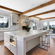 White Open Plan Kitchen With Orchid