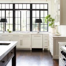 A Renovated Kitchen With Steel Windows and Marble