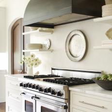 A New Kitchen With Dual Ovens and Custom Range Hood