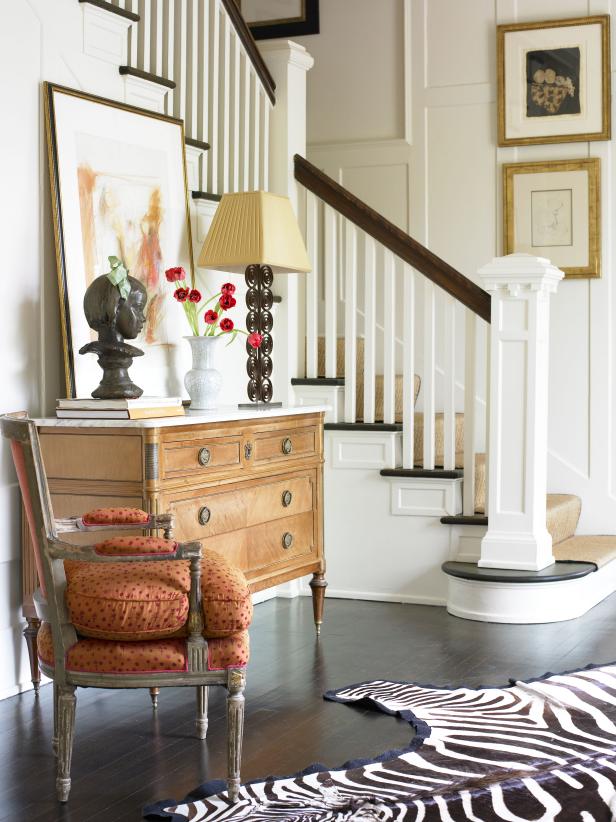 A custom sculpture and zebra rug stand out in the foyer.