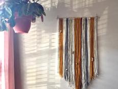 Learn how to make a pretty, boho statement piece from yarn and beads.