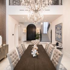 Brown and White Dining Room With Chandelier