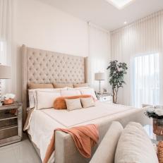 White Main Bedroom With Peach Pillows