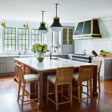 Gray Transitional Chef Kitchen With Black Pendants