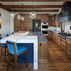 Rustic Chef Kitchen With Blue Barstools
