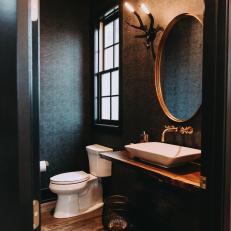 Gray Powder Room With Antler Sconces