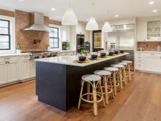 Bold Black Island With Bamboo Stools Makes a Statement in Kitchen