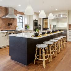 Bold Black Island With Bamboo Stools Makes a Statement in Classy Kitchen