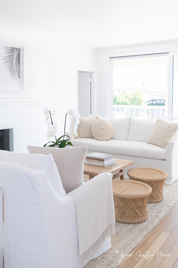 White Scandinavian Living Room With Round Stools | HGTV