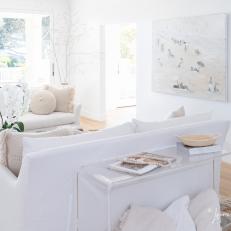 White Scandinavian Living Room With Beach Art