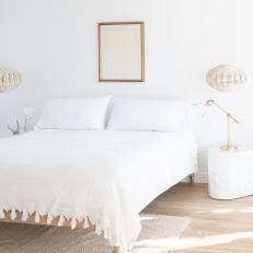 White Scandinavian Bedroom With Fringed Bedspread