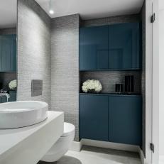 Gray Bathroom With Blue Cabinets