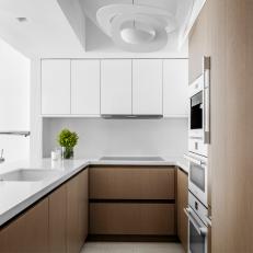 White Small Kitchen With Sculptural Pendant