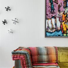 Multicolored Sofa and Artwork