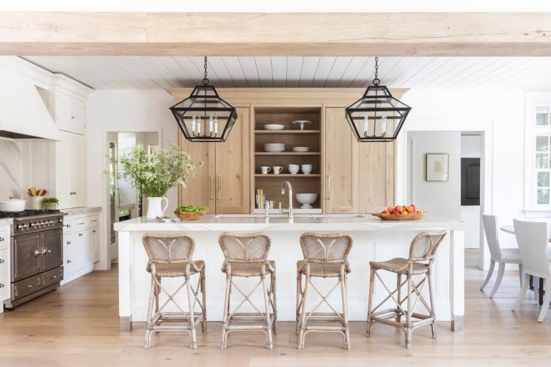 Open Plan Kitchen Features a Large Island and Natural Wood Cabinetry