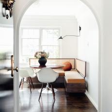 Eclectic Breakfast Room With White Chairs