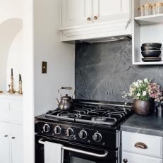 White Kitchen With Black Stove