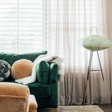 Neutral Sitting Area With Green Sofa