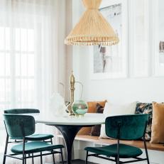 Eclectic Dining Area With Green Chairs