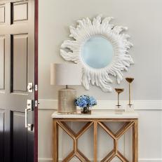 Transitional Foyer With Sun Mirror