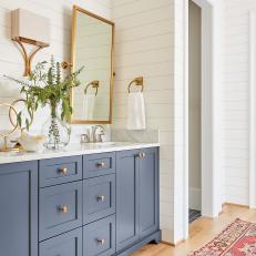 Blue and White Bathroom With Shiplap Paneling
