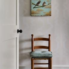 Hallway With Chair and Bird Painting