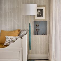 Bedroom With Teal Lamp and Yellow Pillow