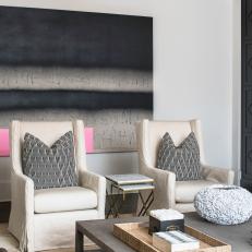 Gray and White Sitting Room With Pink Art