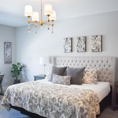 Gray Cottage Bedroom With Tufted Headboard