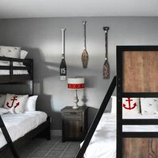 Gray Coastal Bedroom With Red Anchor Pillow