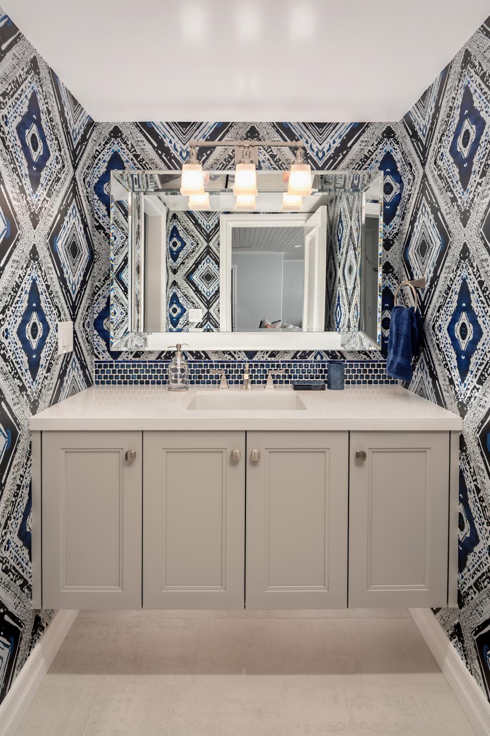 Blue Powder Room With Geometric Wallpaper | HGTV