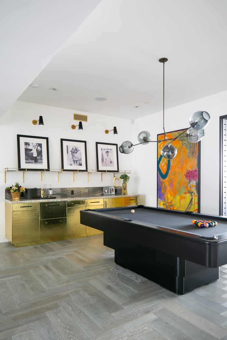 Game Room Features a Pool Table and a Hammered Brass Bar