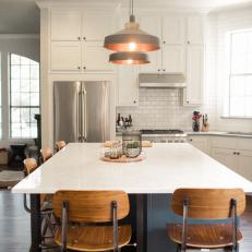 White Open Plan Kitchen With Gray Pendants