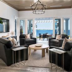 Waterfront Sitting Room With Gray Armchairs